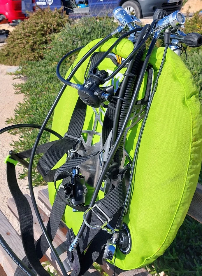 My current lime-green sidemount BCD and harness setup